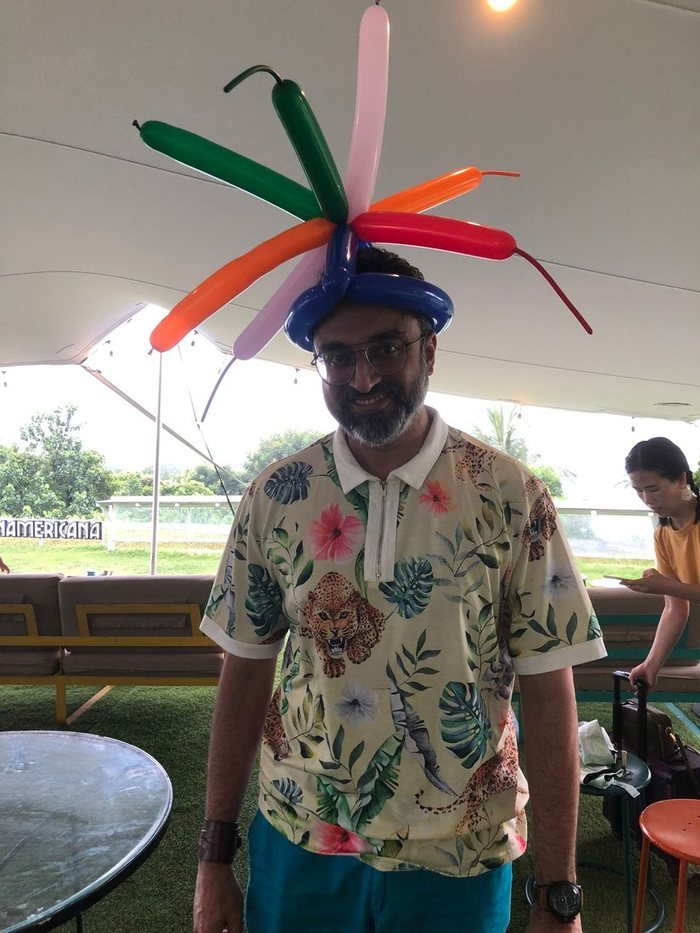 Our artist wearing a balloon hat at an outdoor party