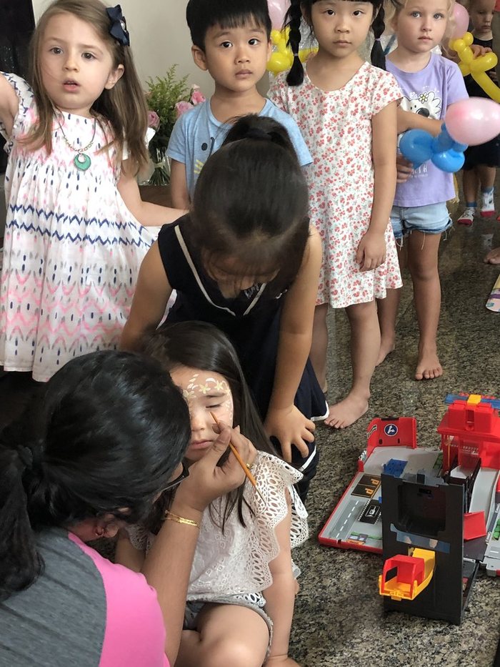 Children waiting their turn at the face painting station