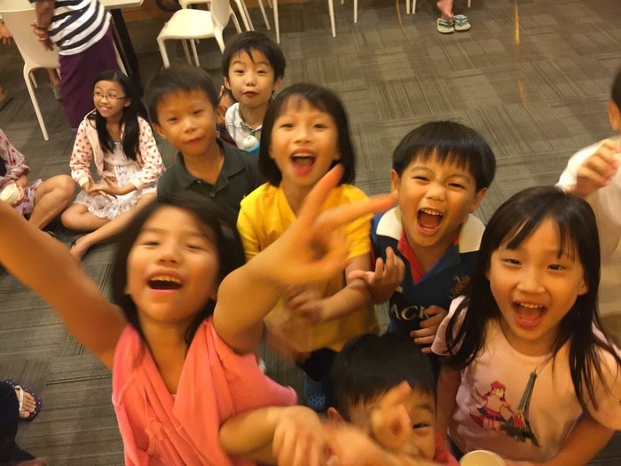 Children laughing together at a birthday party