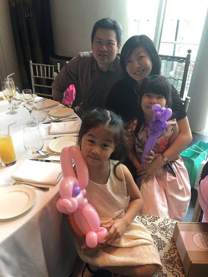 Family together with balloon flowers at a party