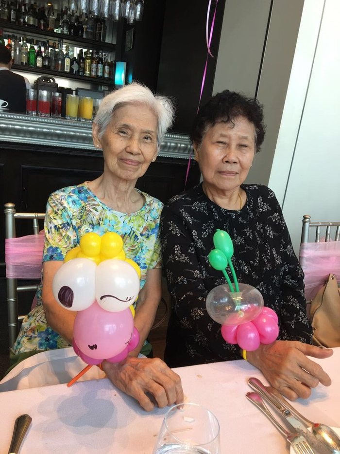 Grandmothers at a party with their balloon creations
